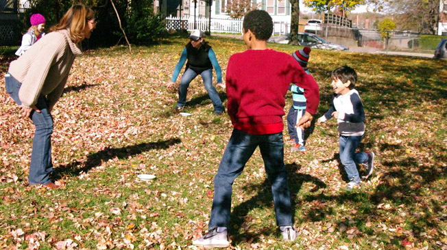 Children and adults play
tag