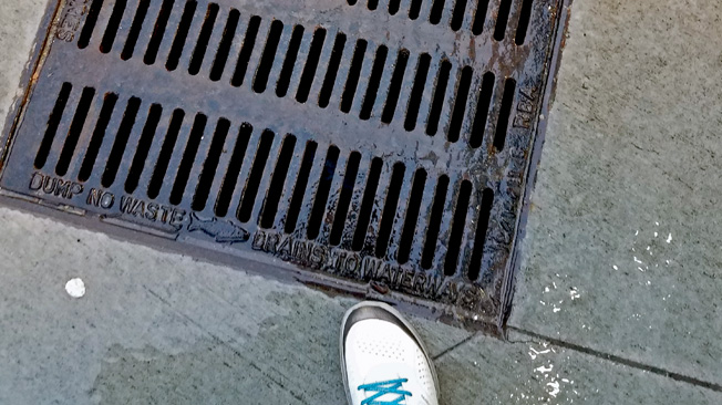 Water flows to storm drain